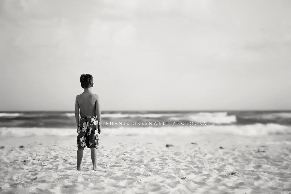 boy standing on beach gulf beach emerald coast destin florida stephanie greenwell photography