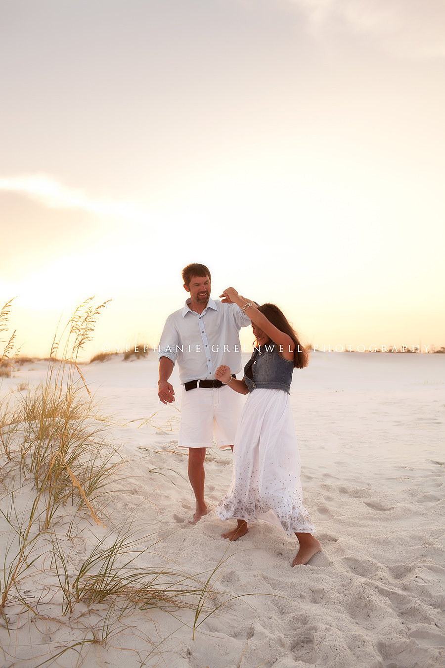 destin florida photographer family dancing with daughter beach sand dunes okaloosa island ft walton beach