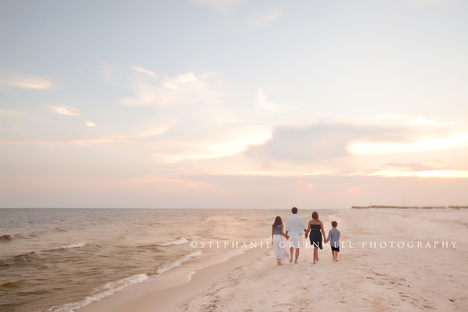 destin florida photographer family walking on beach sand dunes okaloosa island ft walton beach