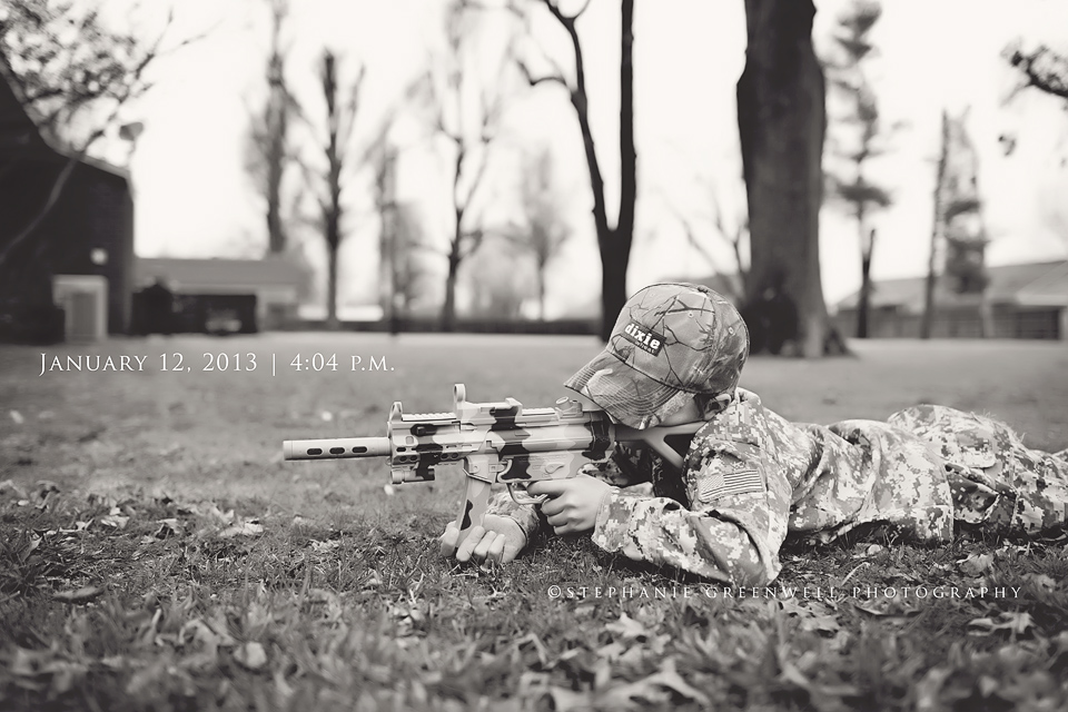 boy in soldier uniform pretend play camo missouri photographer