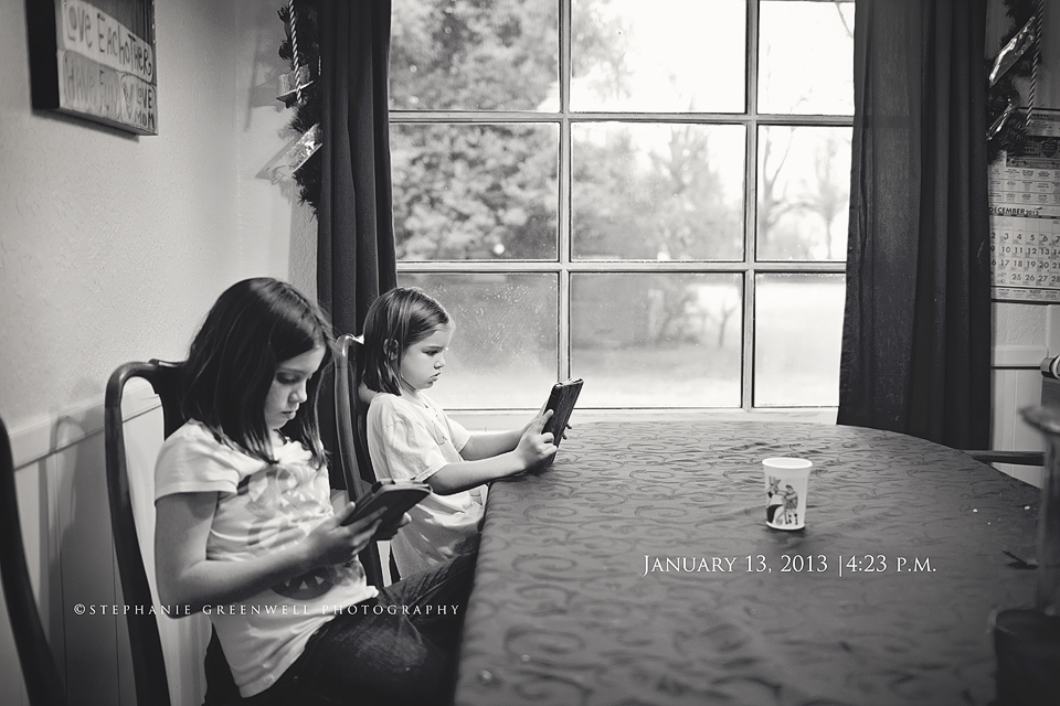 girls using kindle at dinner table stephanie greenwell