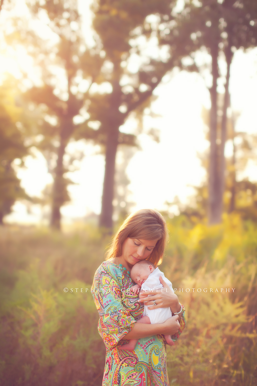 newborn in a field forest mom holding baby vintage southeast missouri photographer stephanie greenwell